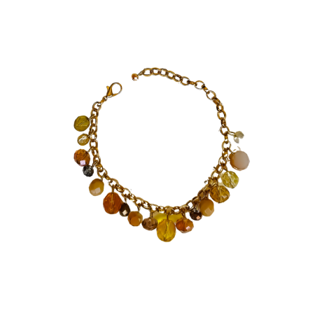 Pulseira dourada da Coleção Essência em pedrarias múltiplas e acabamento dourado.